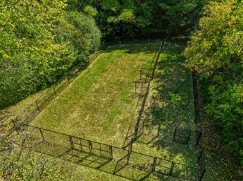 Spacious pet park at three oaks apartments in troy, mi.